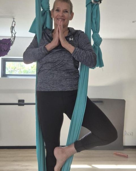 Linda in aerial yoga silks